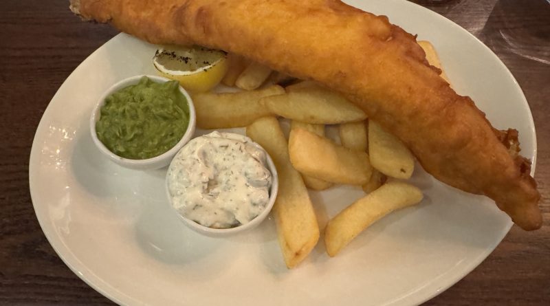 Traditional Fish and Chips served at Browns Cardiff with chunky chips, mushy peas, tartar sauce and grilled lemon.